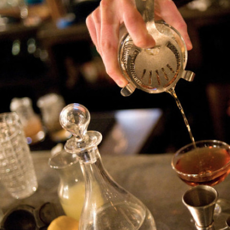 Cocktail being poured from a shaker