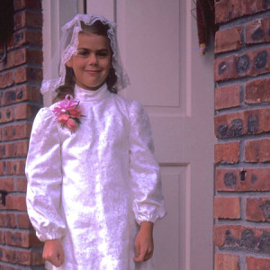 dark haired little girl in communion outfit